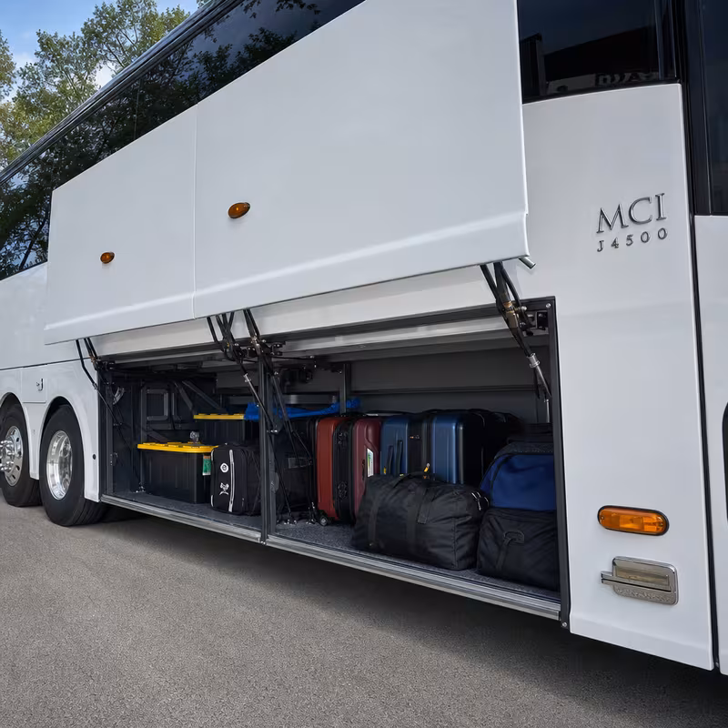 Party bus interior with wraparound leather seating and LED lighting in Boston