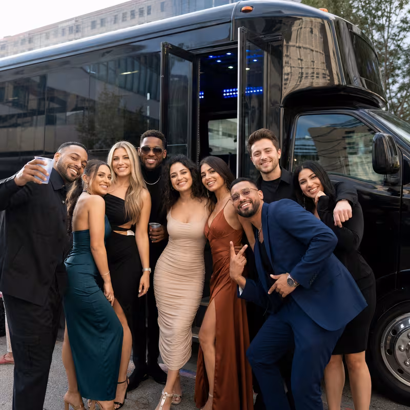 Party bus interior with wraparound leather seating and LED lighting in Boston