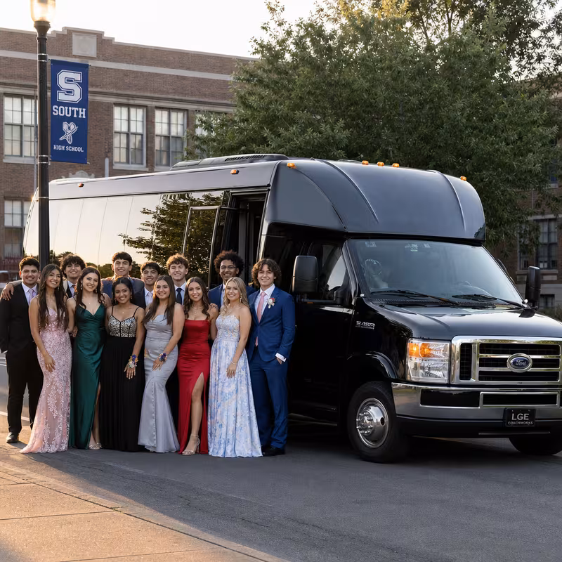Group boarding a white charter bus for Prom & Homecoming Transportation transportation in Boston