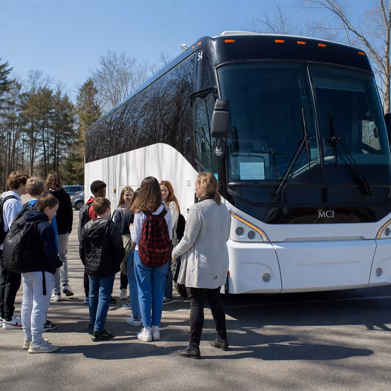 Black Mercedes Sprinter van staged for an Boston School Transportation group