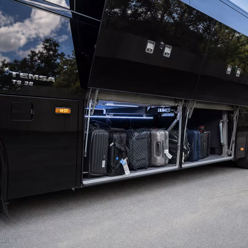 Party bus interior with wraparound leather seating and LED lighting in Boston