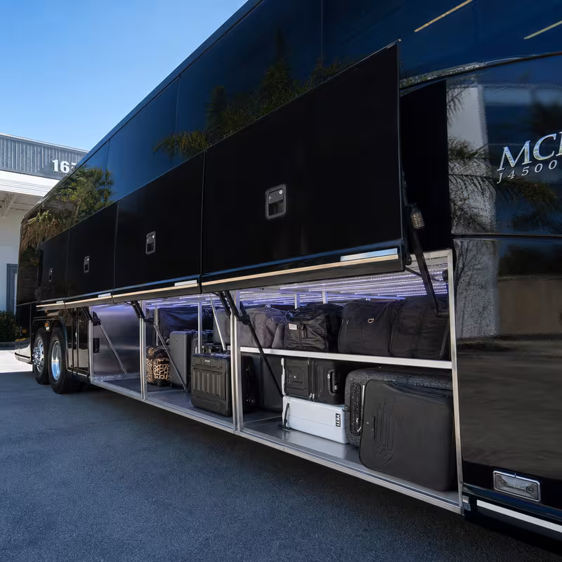 Party bus interior with wraparound leather seating and LED lighting in Boston