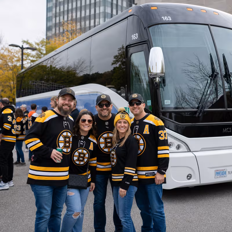 Passengers loading luggage while boarding an Boston group shuttle