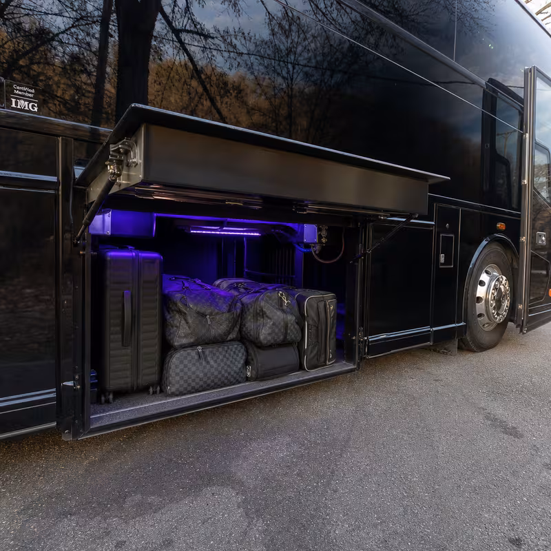 Party bus interior with wraparound leather seating and LED lighting in Boston